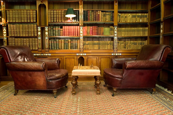 Two leather chairs in an old library