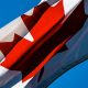 Photograph of a Canadian flag blowing in the wind